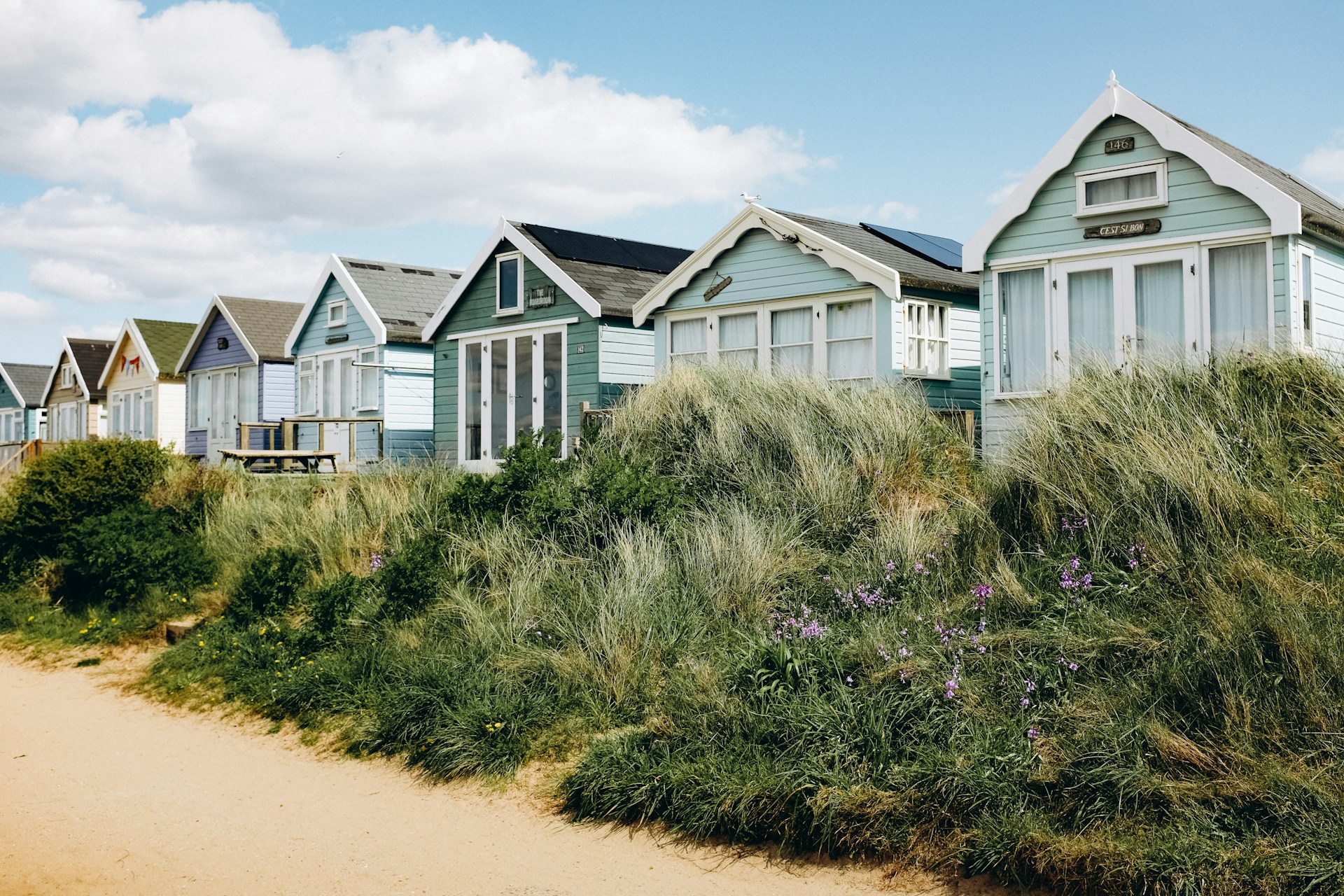 A row of eight beachside holiday homes.